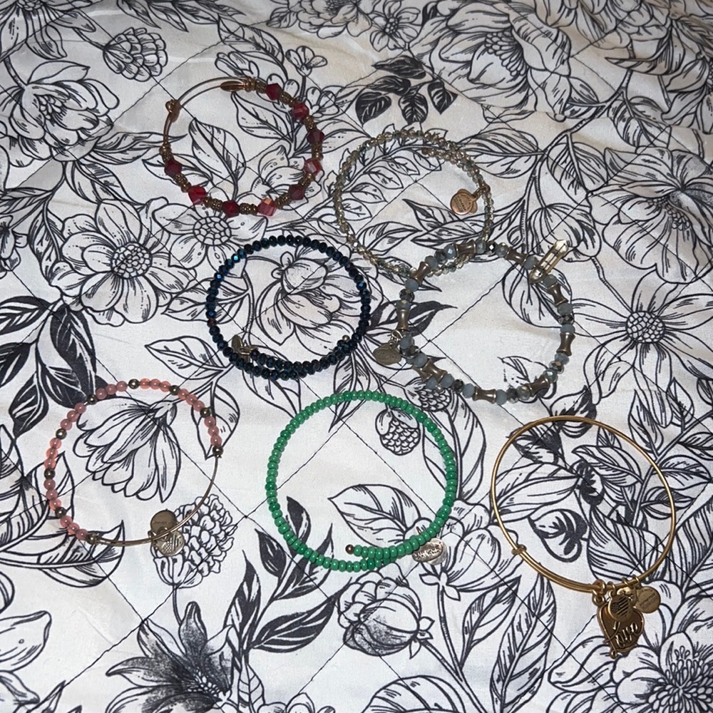 Alex and Ani variety of bracelets.